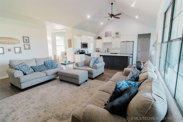 11940 County Road 3513, Ada, OK 74820 - living area with light wood finished floors, high vaulted ceiling, ceiling fan, and recessed lighting