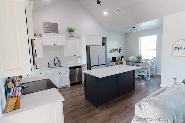 11940 County Road 3513, Ada, OK 74820 - kitchen with dishwasher, freestanding refrigerator, tasteful backsplash, white cabinets, and recessed lighting