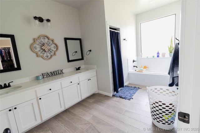 11940 County Road 3513, Ada, OK 74820 - bathroom featuring double vanity, tiled bath, and a shower with curtain