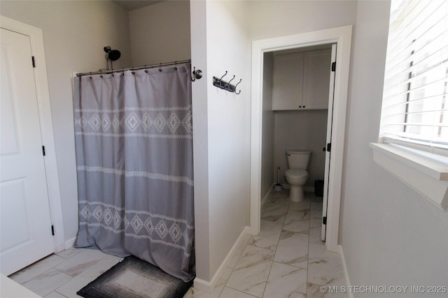11940 County Road 3513, Ada, OK 74820 - bathroom featuring marble look tile flooring and a shower with shower curtain