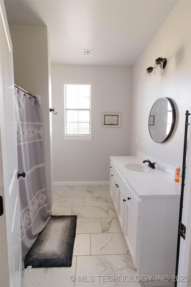 11940 County Road 3513, Ada, OK 74820 - bathroom featuring marble look tiles and vanity