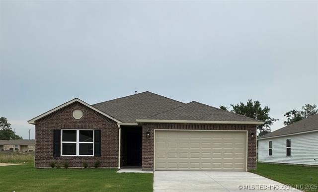 8308 E Oakland St, Broken Arrow, OK 74014 - ranch-style home featuring brick siding, concrete driveway, a garage, and a front yard