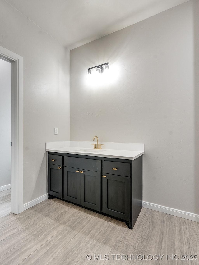 12098 County Road 3513th Loop, Ada, OK 74820 - bathroom with wood finished floors and vanity