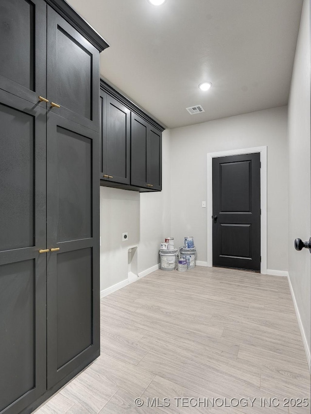 12098 County Road 3513th Loop, Ada, OK 74820 - laundry area with hookup for an electric dryer, light wood-style flooring, and recessed lighting