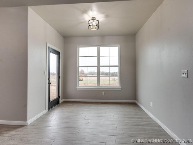 12098 County Road 3513th Loop, Ada, OK 74820 - spare room featuring light wood-style floors and baseboards