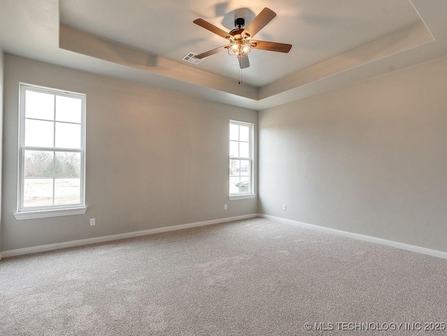 12098 County Road 3513th Loop, Ada, OK 74820 - carpeted spare room with a tray ceiling and ceiling fan