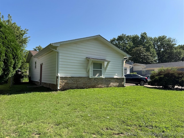 508 W Toledo Pl, Broken Arrow, OK 74012 - view of property exterior with a lawn and stone siding