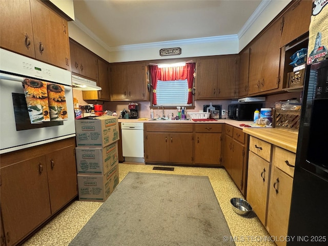 508 W Toledo Pl, Broken Arrow, OK 74012 - kitchen featuring ornamental molding, black appliances, light countertops, light flooring, and under cabinet range hood