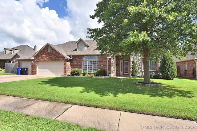 1004 E Fargo St S, Broken Arrow, OK 74012 - view of front facade with an attached garage, brick siding, a front yard, concrete driveway, and roof with shingles