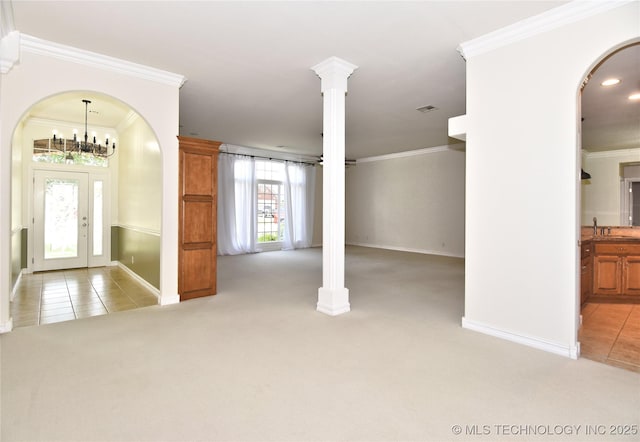 1004 E Fargo St S, Broken Arrow, OK 74012 - foyer entrance with light colored carpet, crown molding, light tile patterned flooring, arched walkways, and recessed lighting