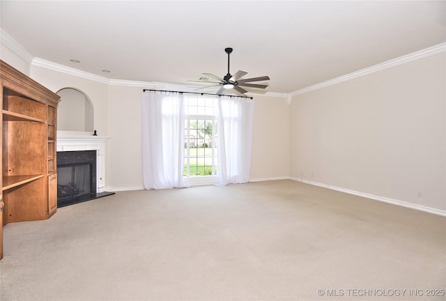 1004 E Fargo St S, Broken Arrow, OK 74012 - unfurnished living room featuring crown molding, a fireplace with raised hearth, ceiling fan, and light colored carpet