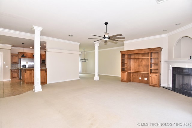 1004 E Fargo St S, Broken Arrow, OK 74012 - unfurnished living room with ceiling fan, a fireplace, crown molding, light colored carpet, and ornate columns