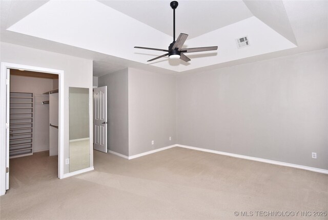 1004 E Fargo St S, Broken Arrow, OK 74012 - unfurnished bedroom with light colored carpet, a spacious closet, and a ceiling fan