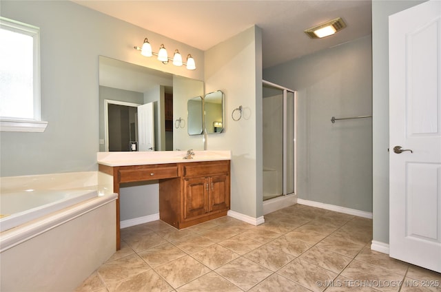 1004 E Fargo St S, Broken Arrow, OK 74012 - bathroom featuring vanity, a shower stall, a bath, and tile patterned floors