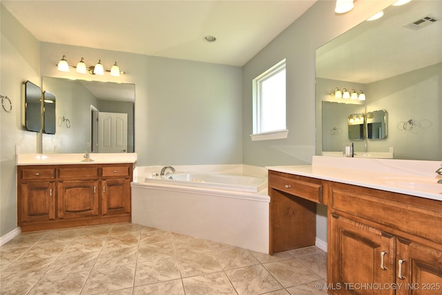 1004 E Fargo St S, Broken Arrow, OK 74012 - bathroom with two vanities and a garden tub