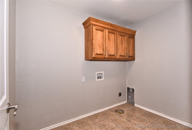 1004 E Fargo St S, Broken Arrow, OK 74012 - laundry room with washer hookup, cabinet space, light tile patterned flooring, and hookup for an electric dryer