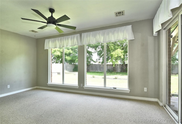 1004 E Fargo St S, Broken Arrow, OK 74012 - empty room featuring light carpet, plenty of natural light, and a ceiling fan
