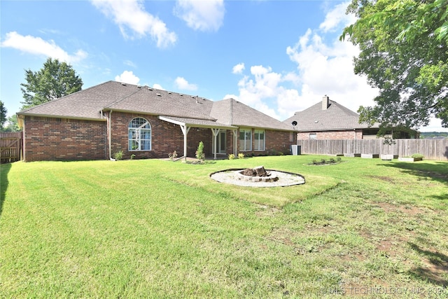 1004 E Fargo St S, Broken Arrow, OK 74012 - back of property featuring an outdoor fire pit, brick siding, and roof with shingles