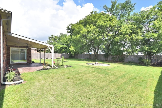 1004 E Fargo St S, Broken Arrow, OK 74012 - fenced backyard featuring a patio and an outdoor fire pit