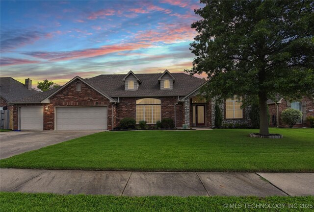 1004 E Fargo St S, Broken Arrow, OK 74012 - view of front facade with a garage, a front lawn, driveway, brick siding, and roof with shingles