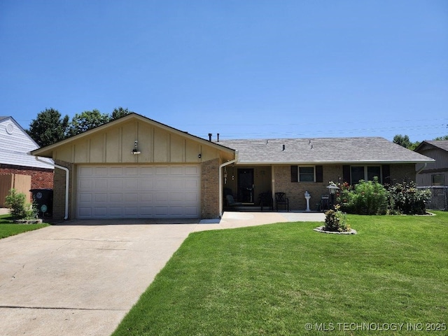 2449 S 144th E Ave, Tulsa, OK 74134 - ranch-style home featuring brick siding, driveway, an attached garage, a front lawn, and board and batten siding