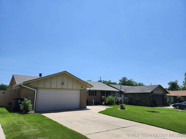 2449 S 144th E Ave, Tulsa, OK 74134 - single story home featuring concrete driveway, board and batten siding, a front yard, brick siding, and a garage