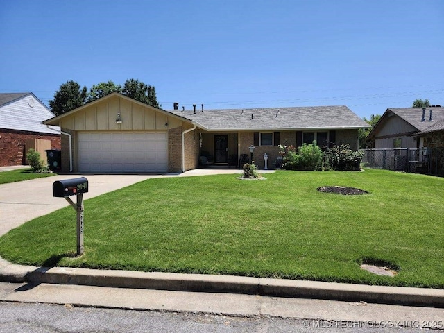 2449 S 144th E Ave, Tulsa, OK 74134 - single story home with board and batten siding, driveway, brick siding, and an attached garage