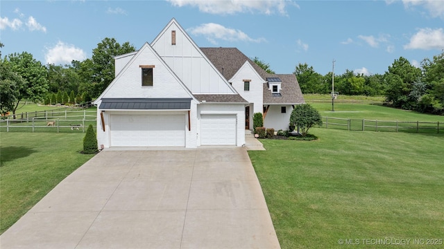 7383 S 288th E Ave, Broken Arrow, OK 74014 - view of front of property with a standing seam roof, driveway, a metal roof, and board and batten siding