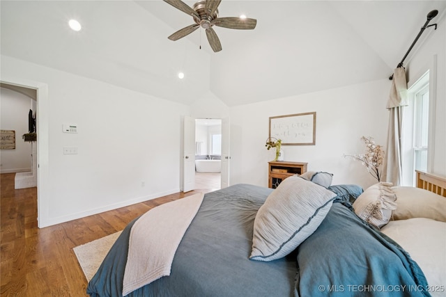 7383 S 288th E Ave, Broken Arrow, OK 74014 - bedroom with lofted ceiling, wood finished floors, ceiling fan, connected bathroom, and recessed lighting