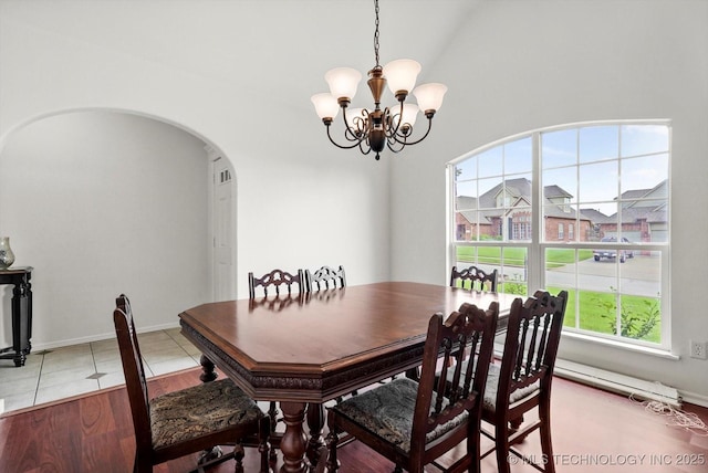 7316 E Knoxville St, Broken Arrow, OK 74014 - dining area with arched walkways and a chandelier