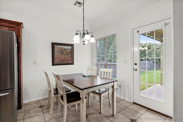 7316 E Knoxville St, Broken Arrow, OK 74014 - dining area featuring a chandelier and light tile patterned flooring
