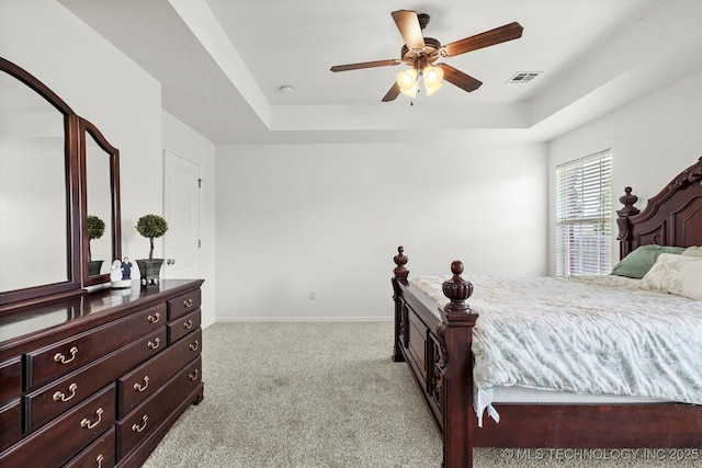 7316 E Knoxville St, Broken Arrow, OK 74014 - bedroom with a tray ceiling, light colored carpet, and a ceiling fan