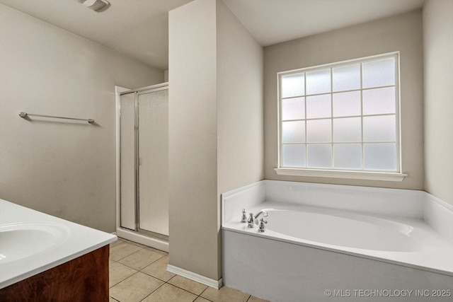 7316 E Knoxville St, Broken Arrow, OK 74014 - full bath with a stall shower, a garden tub, tile patterned floors, and double vanity