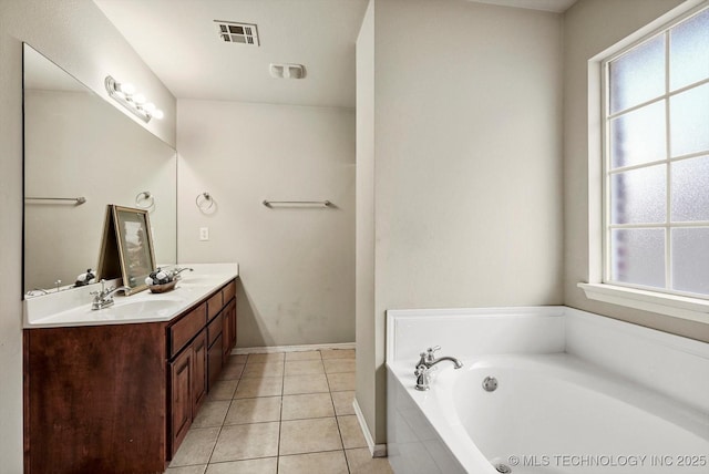 7316 E Knoxville St, Broken Arrow, OK 74014 - bathroom featuring double vanity, a bath, healthy amount of natural light, and tile patterned flooring