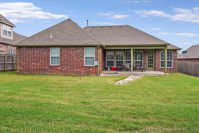 7316 E Knoxville St, Broken Arrow, OK 74014 - back of house featuring brick siding, a fenced backyard, and roof with shingles