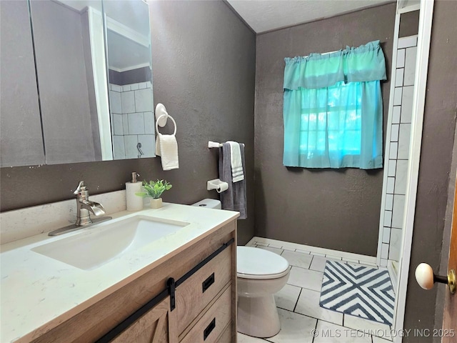 305 Chronister Ave, Drumright, OK 74030 - bathroom with vanity and a textured wall