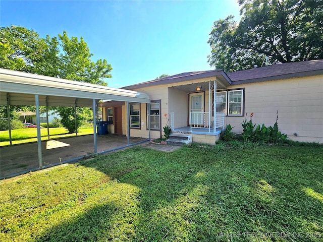 305 Chronister Ave, Drumright, OK 74030 - view of front of house featuring a front lawn and an attached carport