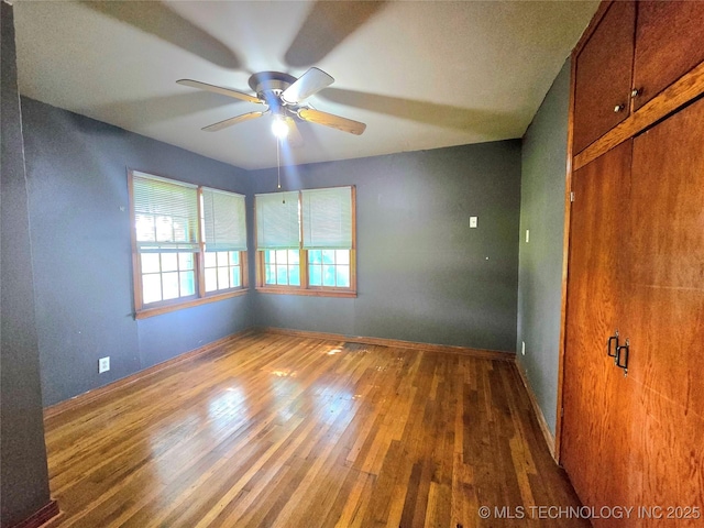 305 Chronister Ave, Drumright, OK 74030 - unfurnished room with ceiling fan and wood finished floors