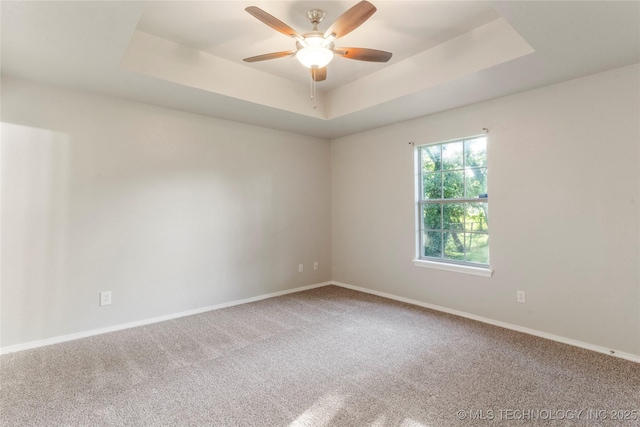 715 S Muskogee St, Sapulpa, OK 74066 - unfurnished room with carpet flooring, a ceiling fan, and a tray ceiling