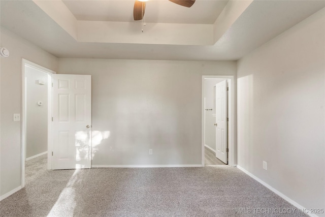 715 S Muskogee St, Sapulpa, OK 74066 - spare room with a raised ceiling, ceiling fan, and carpet