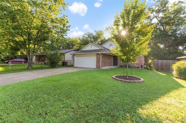 715 S Muskogee St, Sapulpa, OK 74066 - view of front of home with an attached garage, concrete driveway, and brick siding