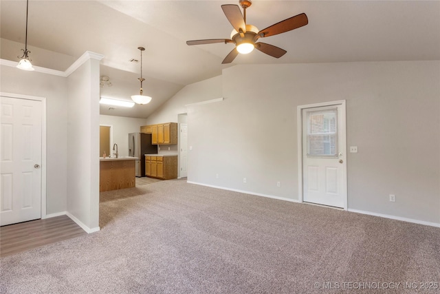 715 S Muskogee St, Sapulpa, OK 74066 - unfurnished living room with light carpet, lofted ceiling, and a ceiling fan