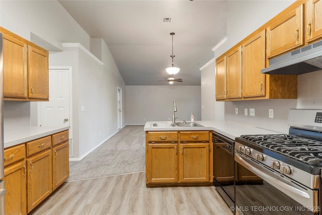 715 S Muskogee St, Sapulpa, OK 74066 - kitchen featuring stainless steel gas stove, a peninsula, light wood-type flooring, vaulted ceiling, and ceiling fan