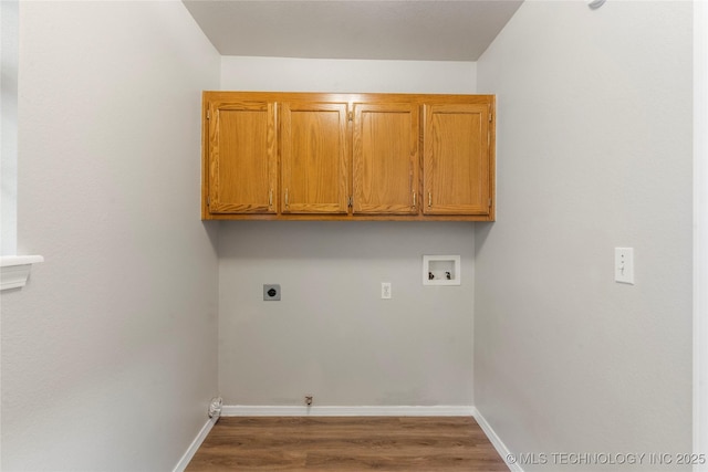 715 S Muskogee St, Sapulpa, OK 74066 - washroom featuring hookup for a washing machine, electric dryer hookup, cabinet space, gas dryer hookup, and wood finished floors
