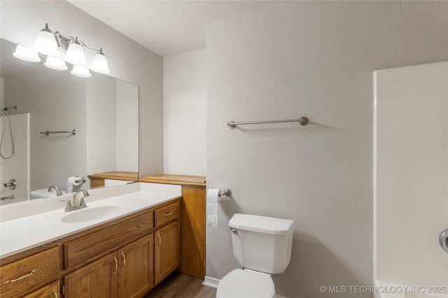 715 S Muskogee St, Sapulpa, OK 74066 - full bathroom featuring vanity, wood finished floors, and bathing tub / shower combination