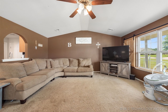 24 Faye Ave, Inola, OK 74036 - living room featuring vaulted ceiling, light colored carpet, ceiling fan, and arched walkways