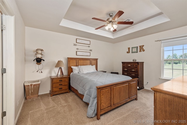 24 Faye Ave, Inola, OK 74036 - bedroom with a raised ceiling, light colored carpet, and a ceiling fan
