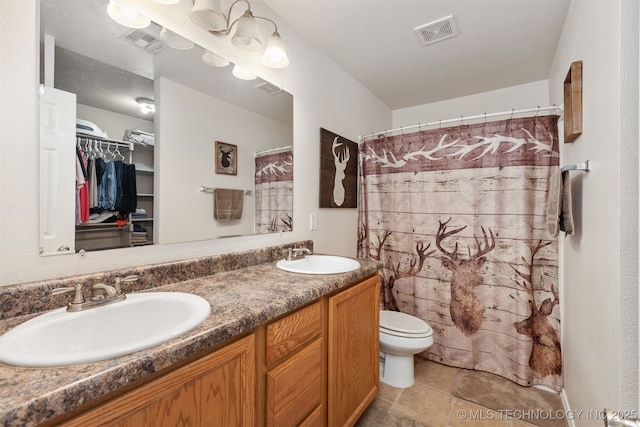 24 Faye Ave, Inola, OK 74036 - full bathroom featuring double vanity, a walk in closet, and curtained shower