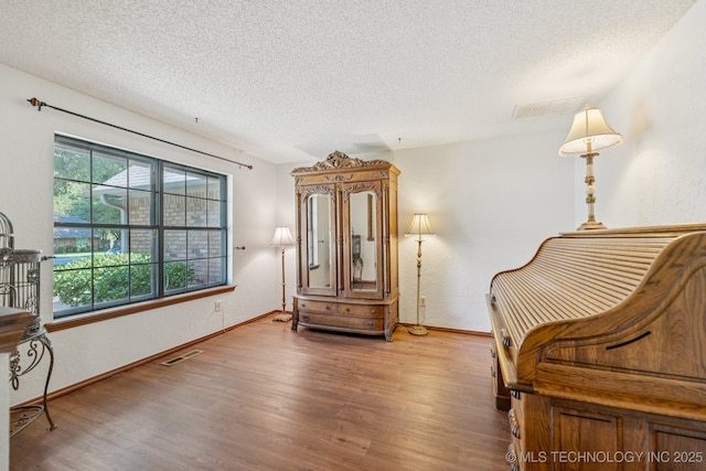 10421 S 197th E Ave, Broken Arrow, OK 74014 - living area with a textured ceiling and wood finished floors