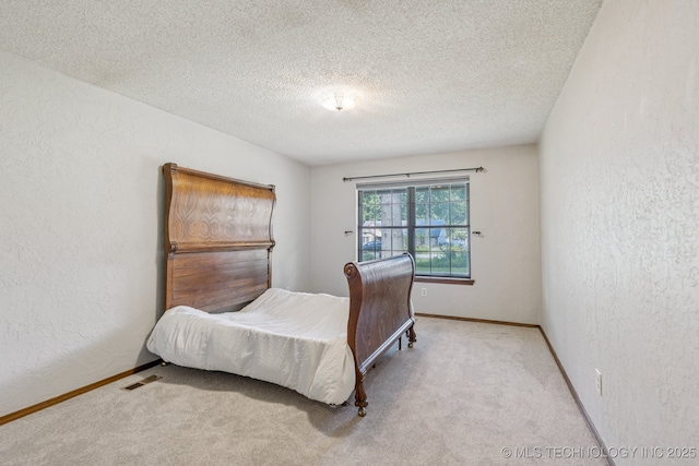 10421 S 197th E Ave, Broken Arrow, OK 74014 - carpeted bedroom with a textured wall and a textured ceiling